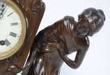 Ansonia Clock Company (1851-2006),  - Relógio americano de mesa de petit bronze, com pátina marrom, estilo ART NOUVEAU. Peça representando figura feminina. Decoração representado garça, fl