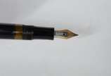 Montblanc (1906),  - Caneta Masterpiece tinteiro na cor preta com dourado.