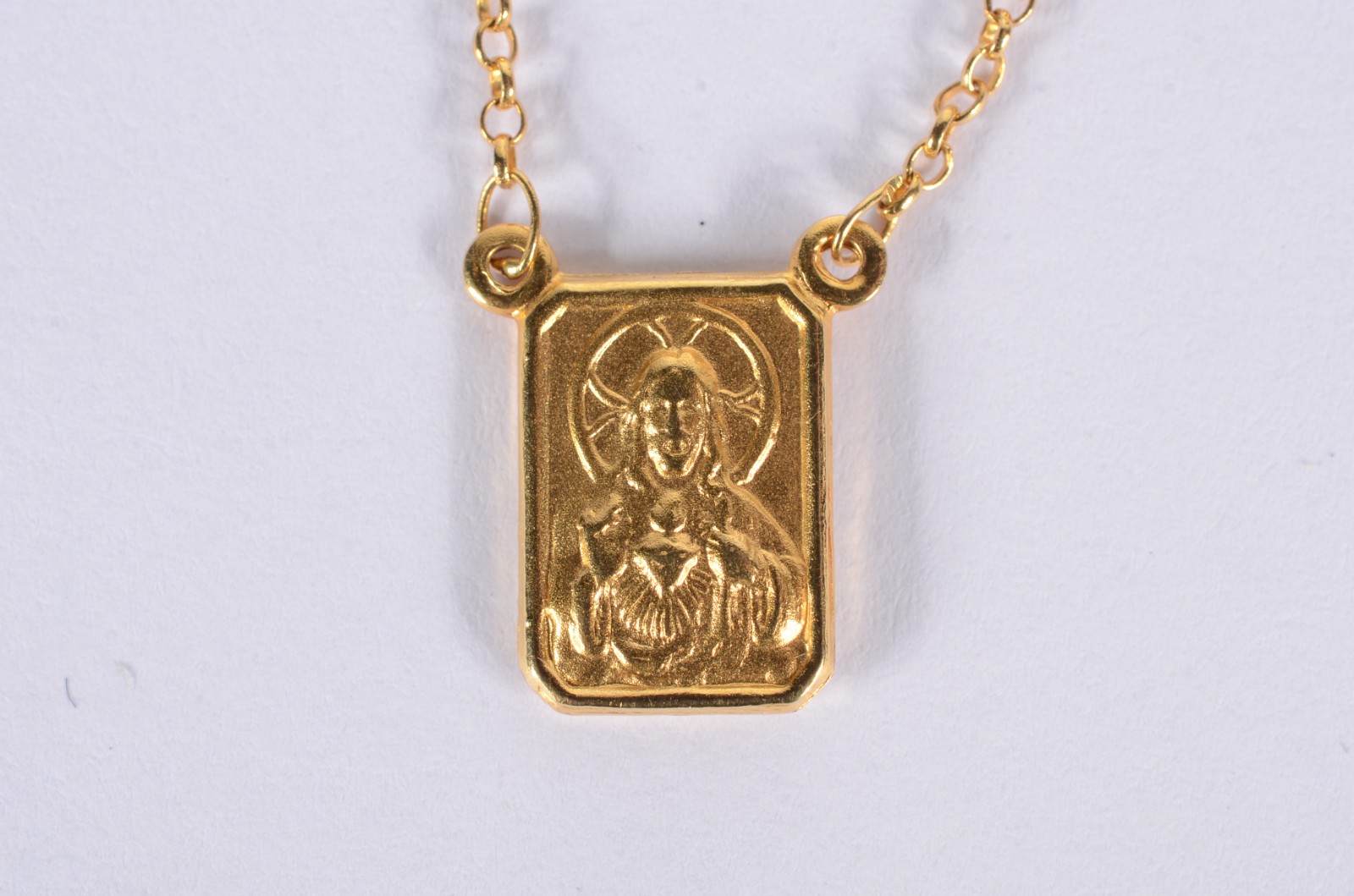 Colar com medalha Sagrado Coração de Jesus de ouro 18 k. (Por motivos... - foto 1 de 5