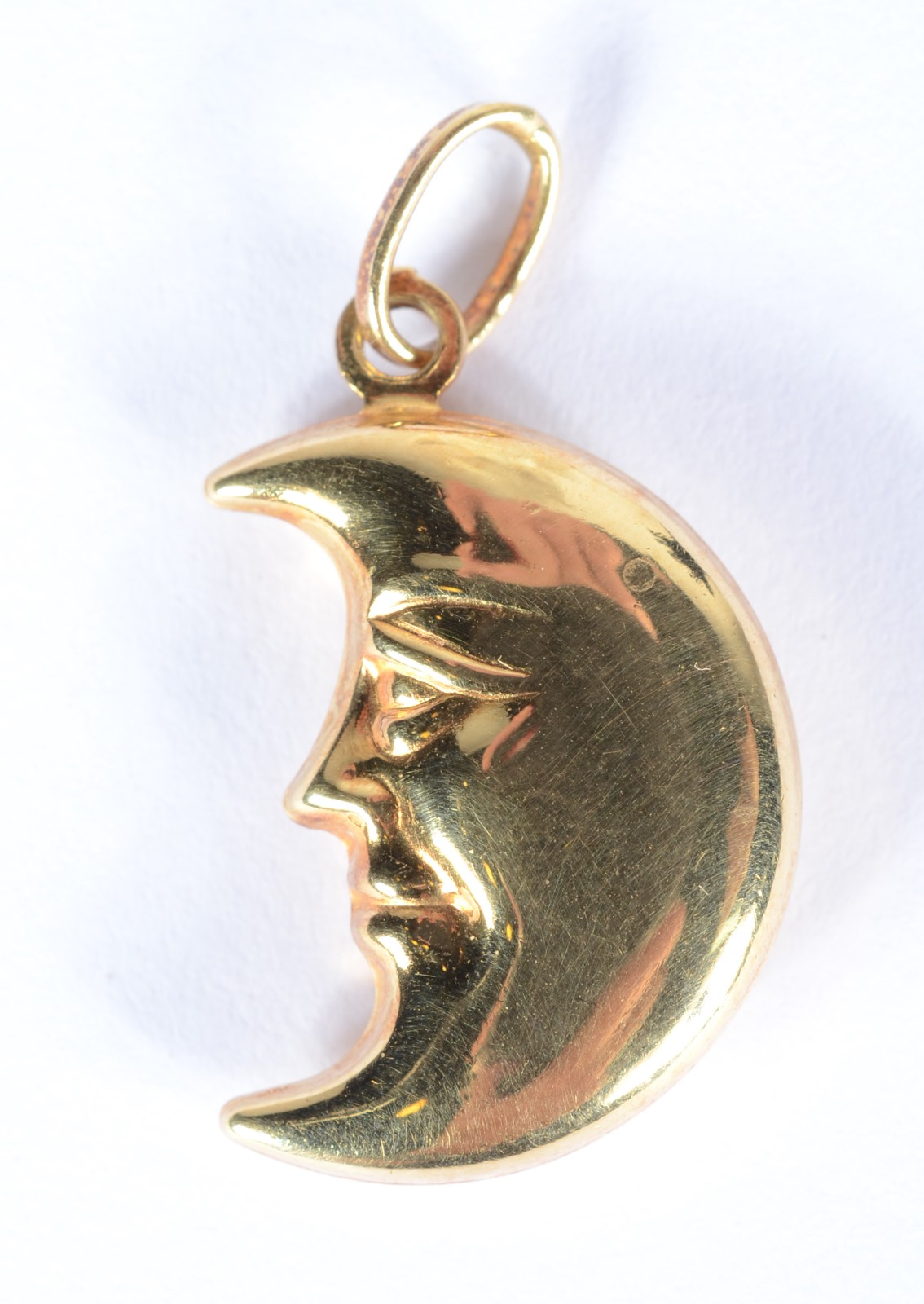 Pendente na forma meia lua de ouro 18 k. (Por motivos de segurança a... - foto 1 de 3