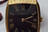 AUDEMARS PIGUET,  - Relógio masculino de ouro 18 k., marca suíça Audemar Piguet, mostrador com algarismos romanos sobre fundo preto. Mostrador medindo 2,00 x 2,20 cm. No 