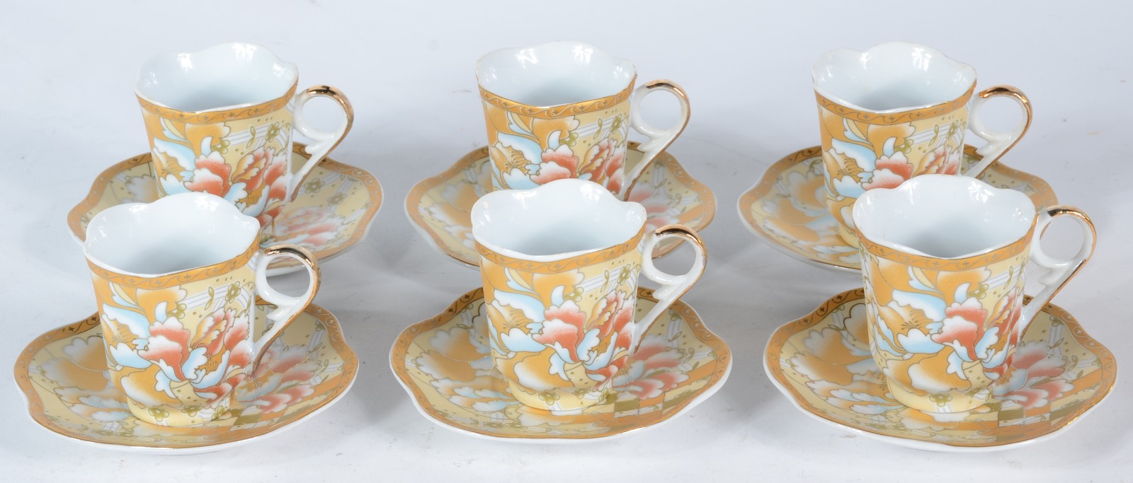 Conjunto com 6 xícaras de café com pires de porcelana floral com... - foto 1 de 4