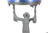 Ravagnani (1962),  - Luminária com base de bronze representando figura feminina e cúpula de vidro com paisagem em policromia.