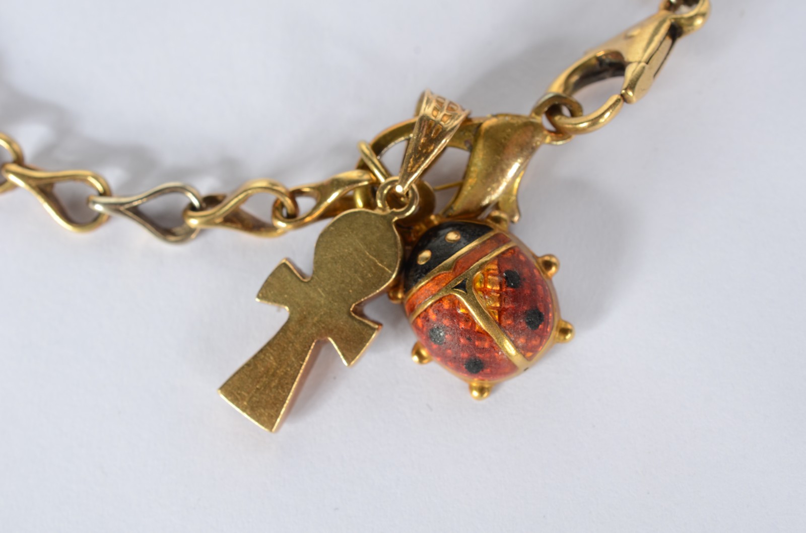 Pulseira de ouro 18k., contraste 750 mls com pendentes na forma de... - foto 1 de 6