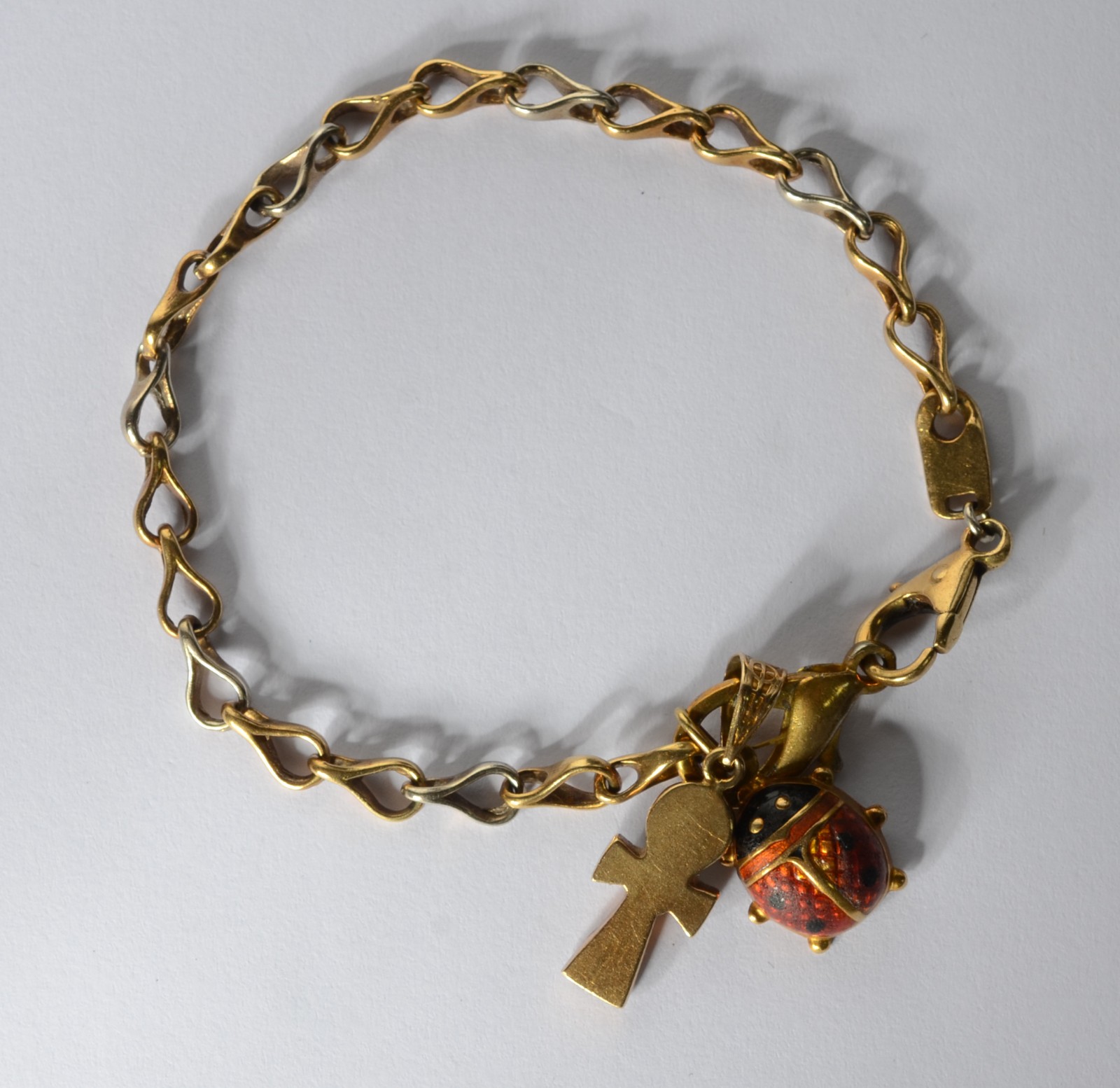 Pulseira de ouro 18k., contraste 750 mls com pendentes na forma de... - foto 3 de 6