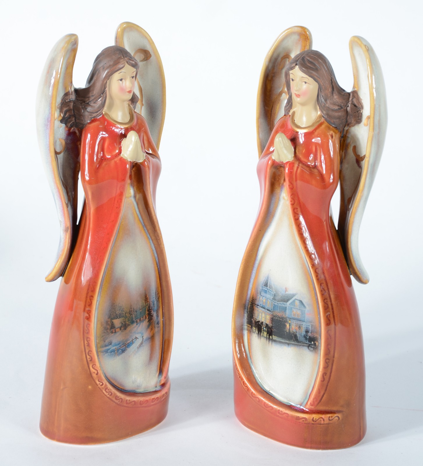 Duas esculturas de porcelana policromada representando anjos. - foto 1 de 5
