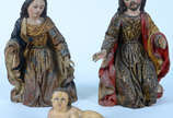  Presepio de madeira policromada, formada por M... -  Presepio de madeira policromada, formada por Menino Jesus em posição budica, Maria e Jose, Sec.XVIII .