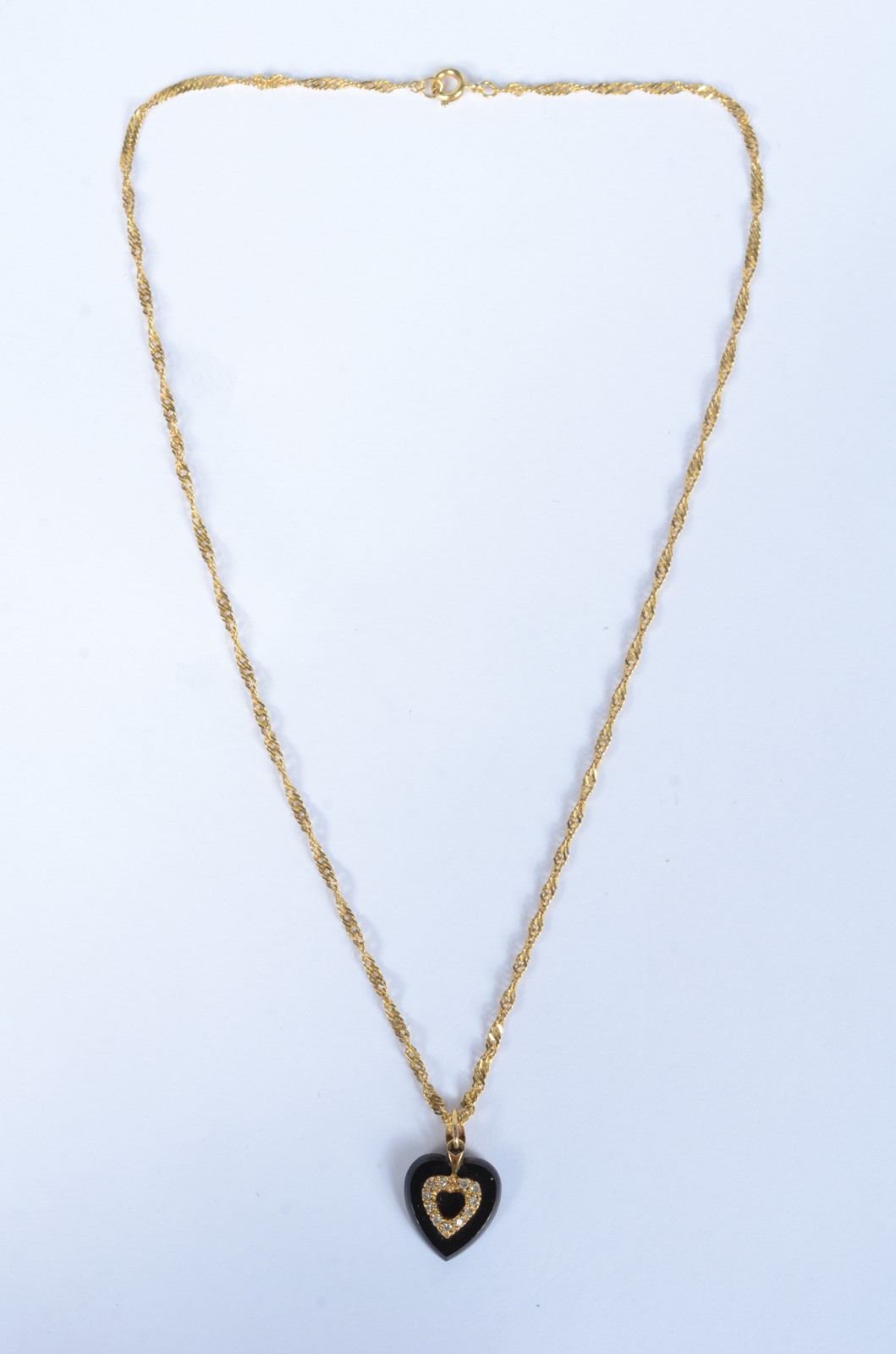Colar com pendente na forma de coração de ouro 18 k., contraste 750... - foto 2 de 6