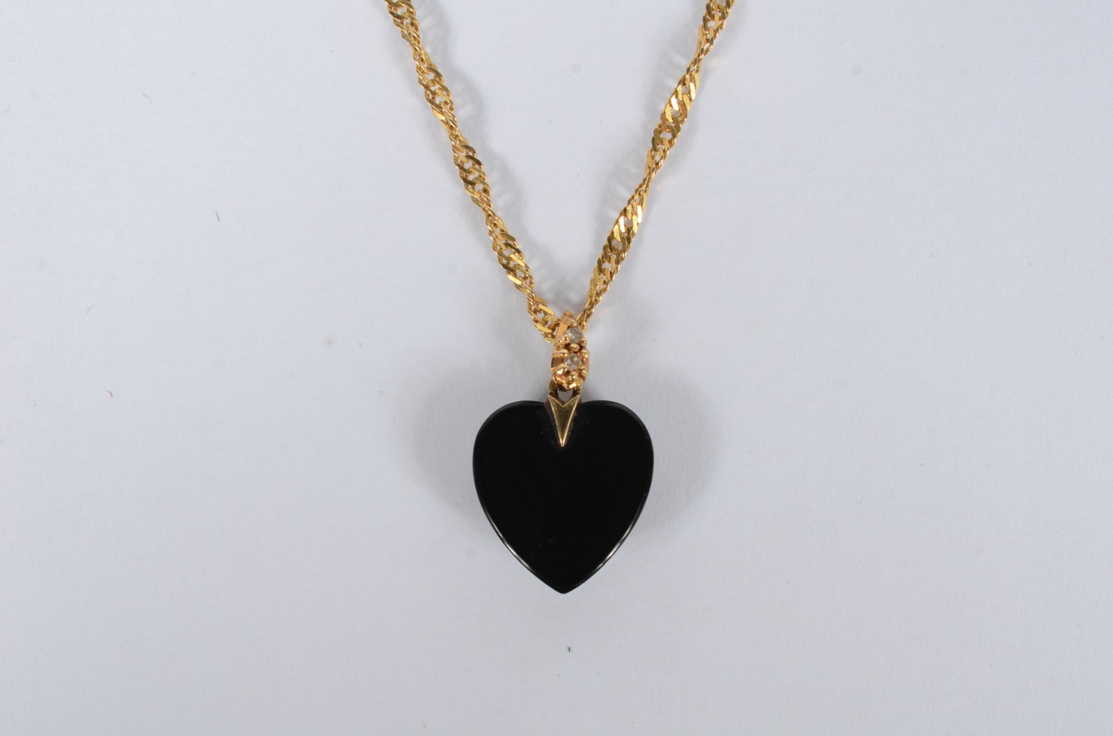 Colar com pendente na forma de coração de ouro 18 k., contraste 750... - foto 5 de 6