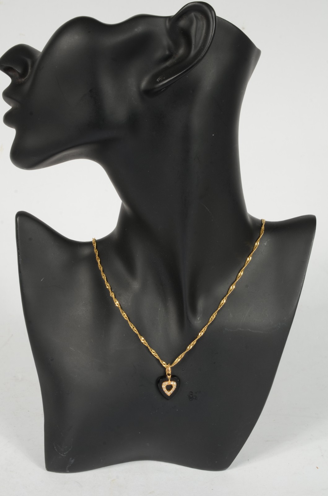 Colar com pendente na forma de coração de ouro 18 k., contraste 750... - foto 6 de 6