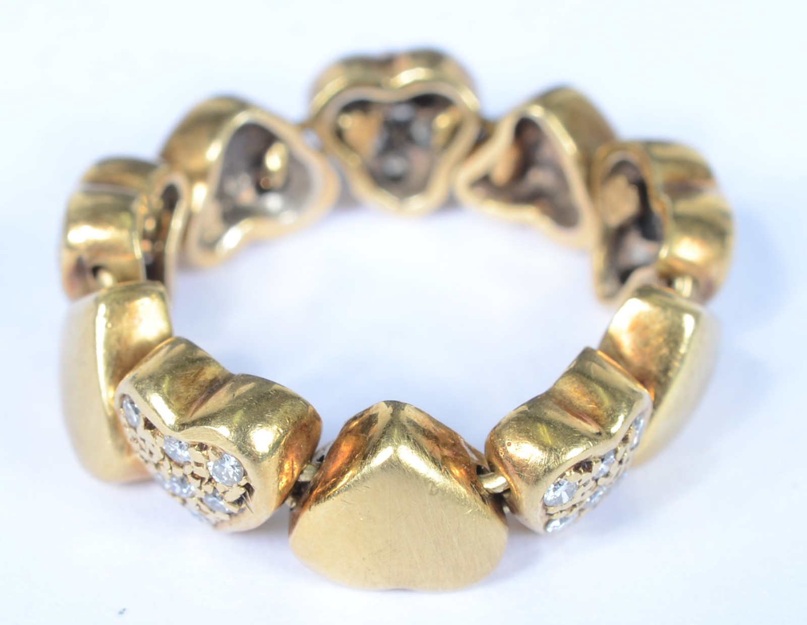 Anel maleável de ouro 18 k., contraste 750 mls com 5 corações... - foto 1 de 5