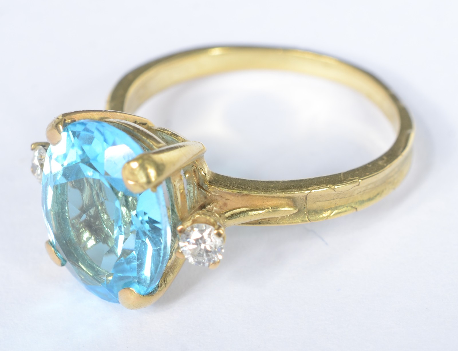 Anel de ouro 18 k., contraste 750 mls com pedra topázio azul e... - foto 1 de 6
