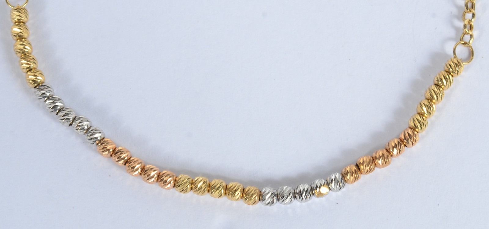 Pulseira de ouro 18 k., contraste 750 mls, bolinhas em três tons... - foto 2 de 3