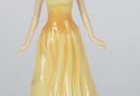 Royal Doulton (1815), October Opal - Escultura de porcelana inglesa representando dama de vestido amarelo.