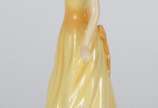 Royal Doulton (1815), October Opal - Escultura de porcelana inglesa representando dama de vestido amarelo.
