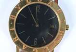 Bulgari (1884),  - Relógio masculino com caixa de ouro amarelo, modelo BB 33 GL, fundo preto, pulseira de couro castanho. Diâmetro 33 mm. (desgastes do uso)
