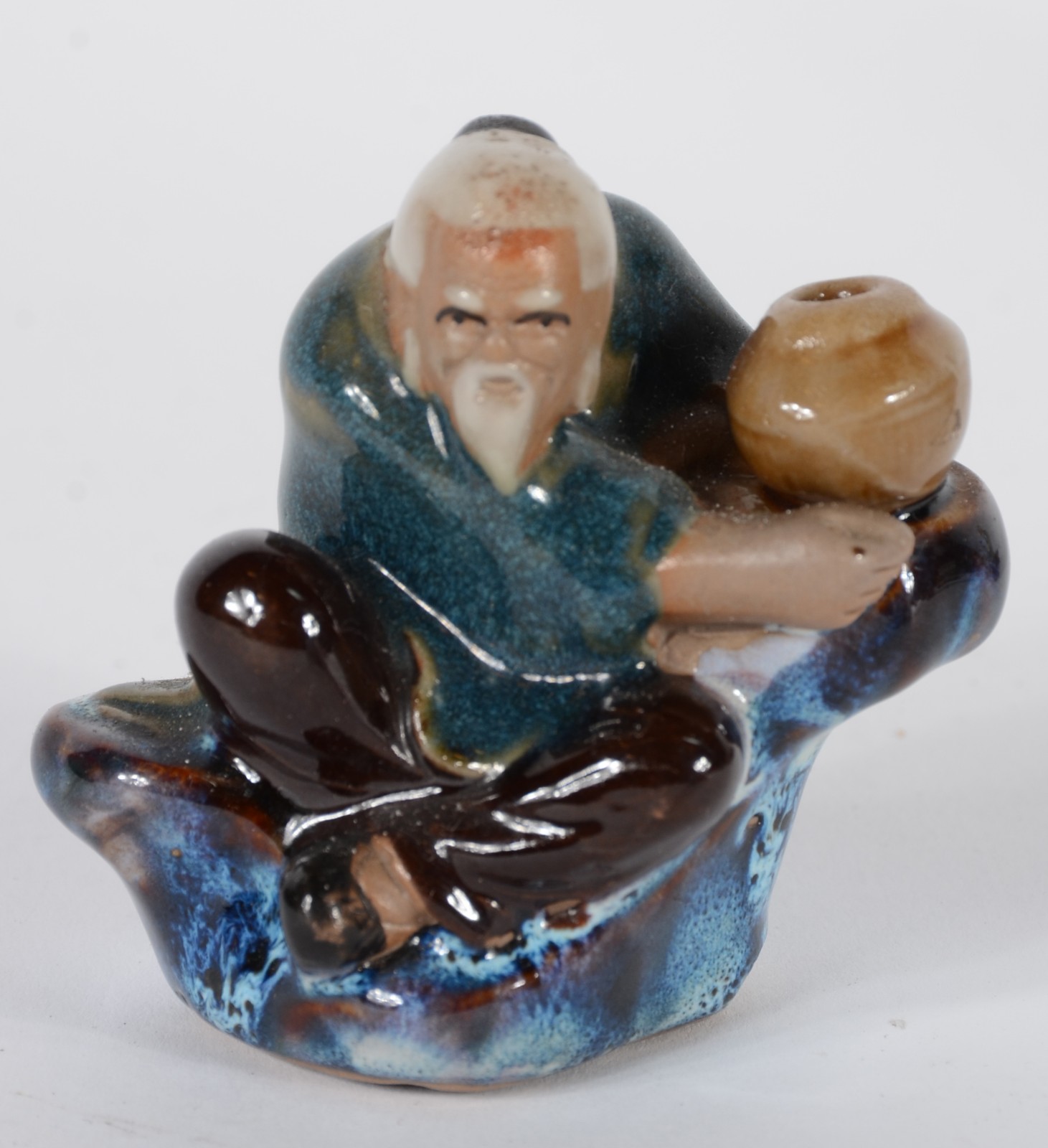 Conjunto com 8 estatuetas diversas de cerâmica oriental policromada. - foto 7 de 10