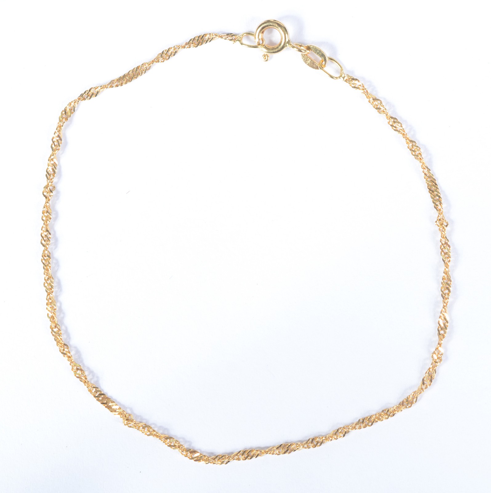 Pulseira feitio "torcido" de ouro 18 k., contraste 750 mls. (Por... - foto 1 de 4