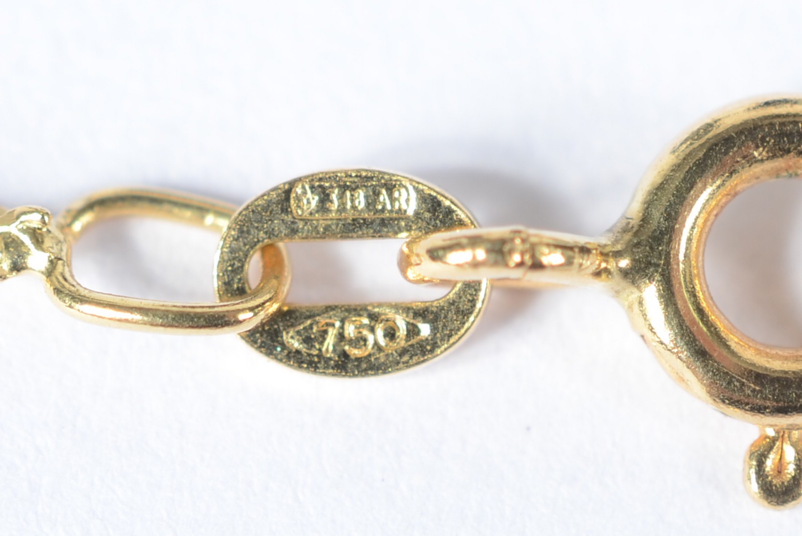 Pulseira feitio "torcido" de ouro 18 k., contraste 750 mls. (Por... - foto 4 de 4