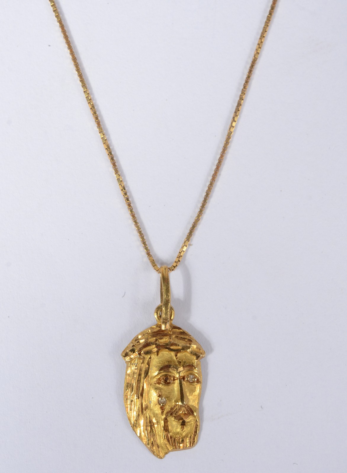 Colar com pendente com rosto de Cristo de ouro 18 k., contraste 750... - foto 1 de 6