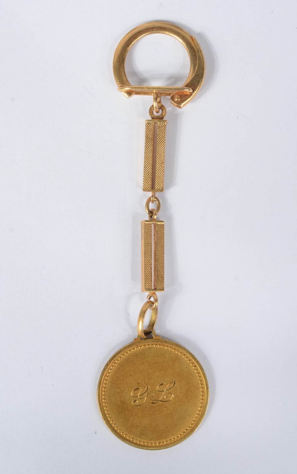 Chaveiro com medalha de ouro 18k., contraste 750 mls. (Por motivos de... - foto 2 de 6
