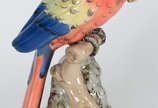 Estatueta de porcelana tcheca policromada repre... - Estatueta de porcelana tcheca policromada representando papagaio, anos 50
