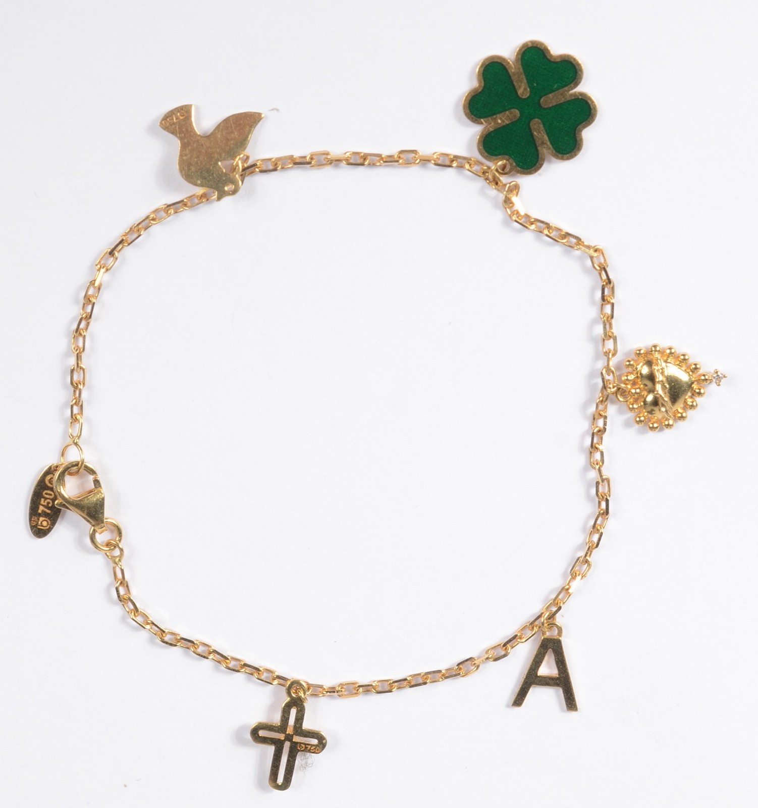 Pulseira de ouro 18 k., contraste 750 mls com penduricalhos. (Por... - foto 1 de 4