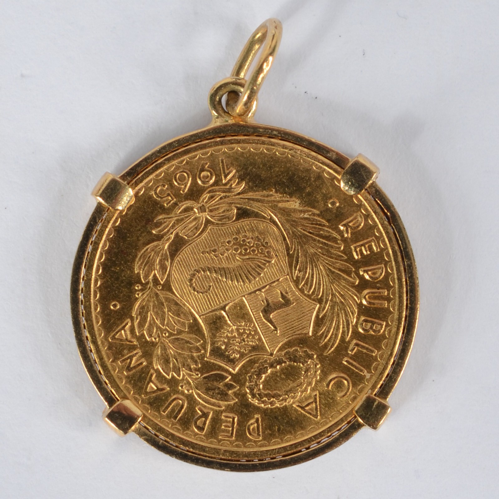 Moeda da Republica Peruana de ouro 18k - Dez soles. Datada 1965. (Por... - foto 2 de 2