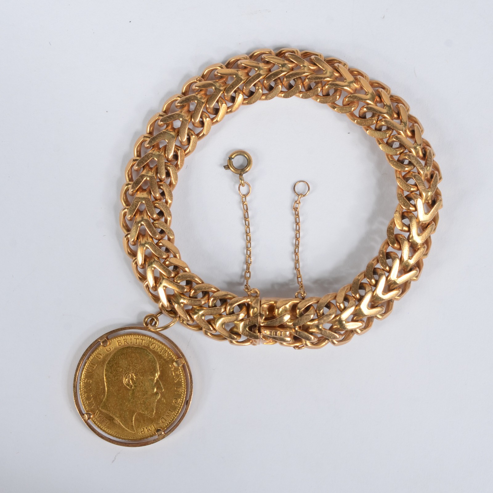 Pulseira de ouro 18k feitio drumete com pingentes de libra. Peso... - foto 1 de 7