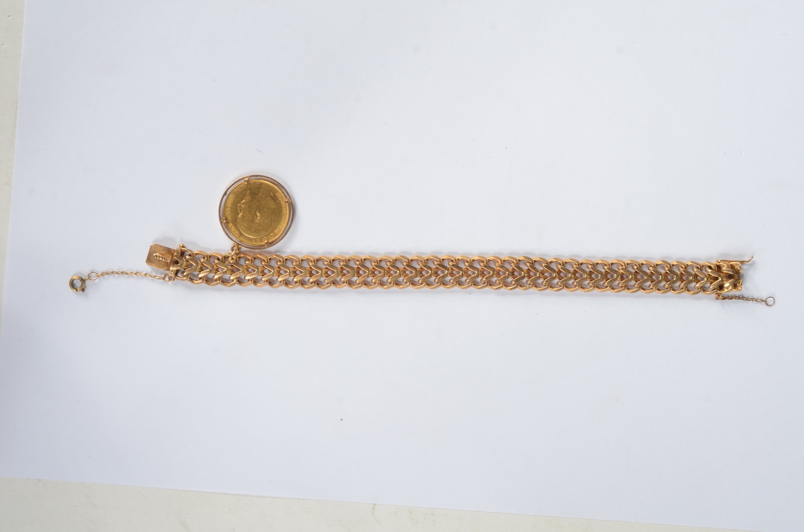 Pulseira de ouro 18k feitio drumete com pingentes de libra. Peso... - foto 2 de 7