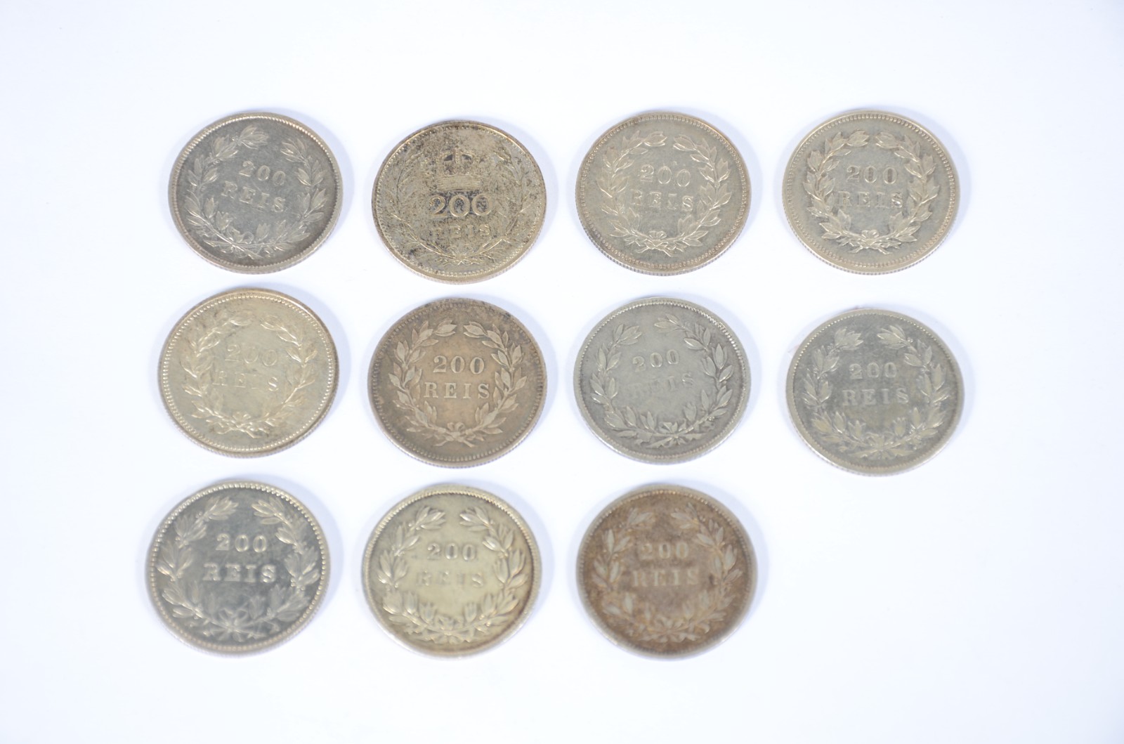 Coleção com 11 moedas portuguesas de prata de 200 reis, sendo 9 do... - foto 1 de 2