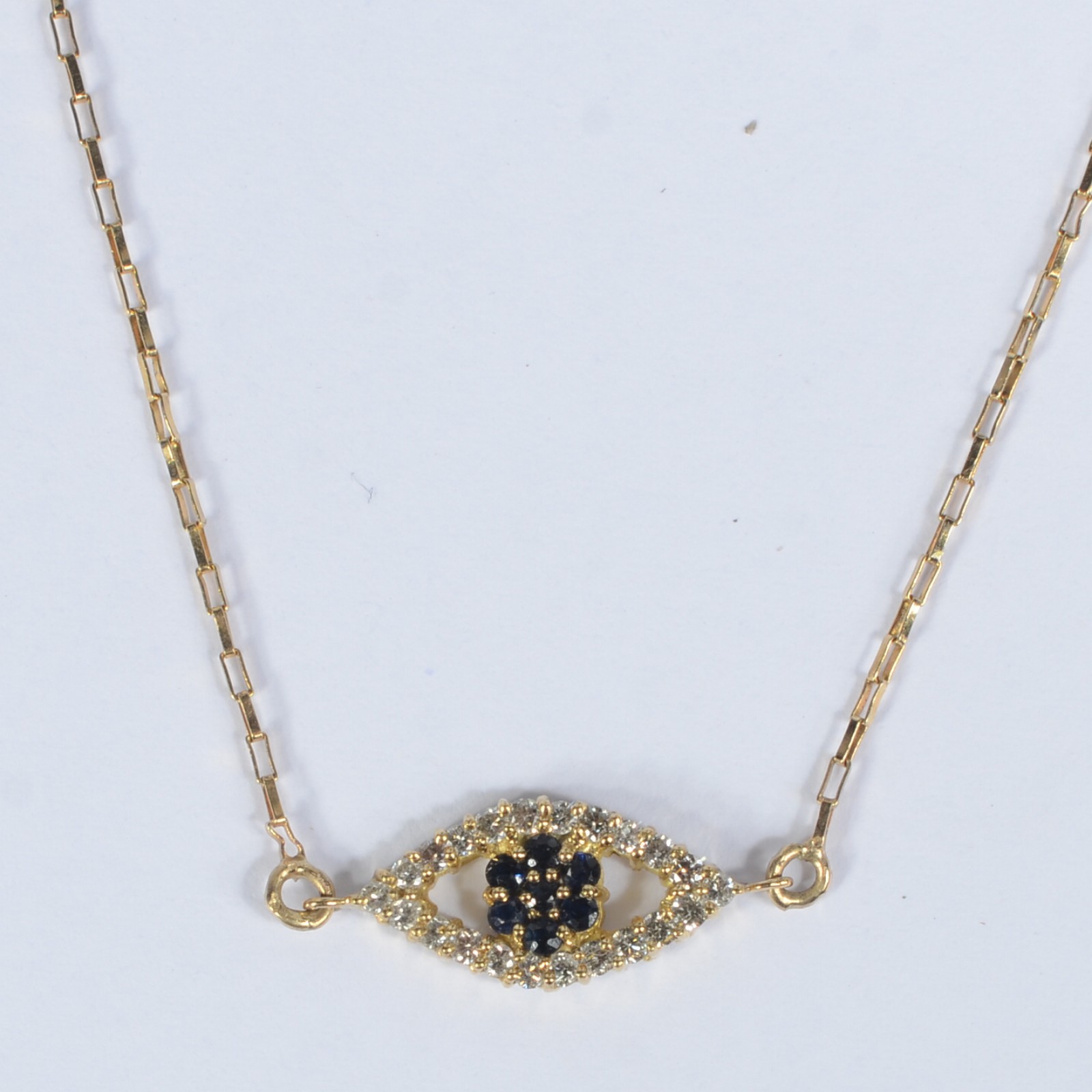Colar com pendente em ouro 18k 750, feitio de elos e olho grego em... - foto 1 de 5