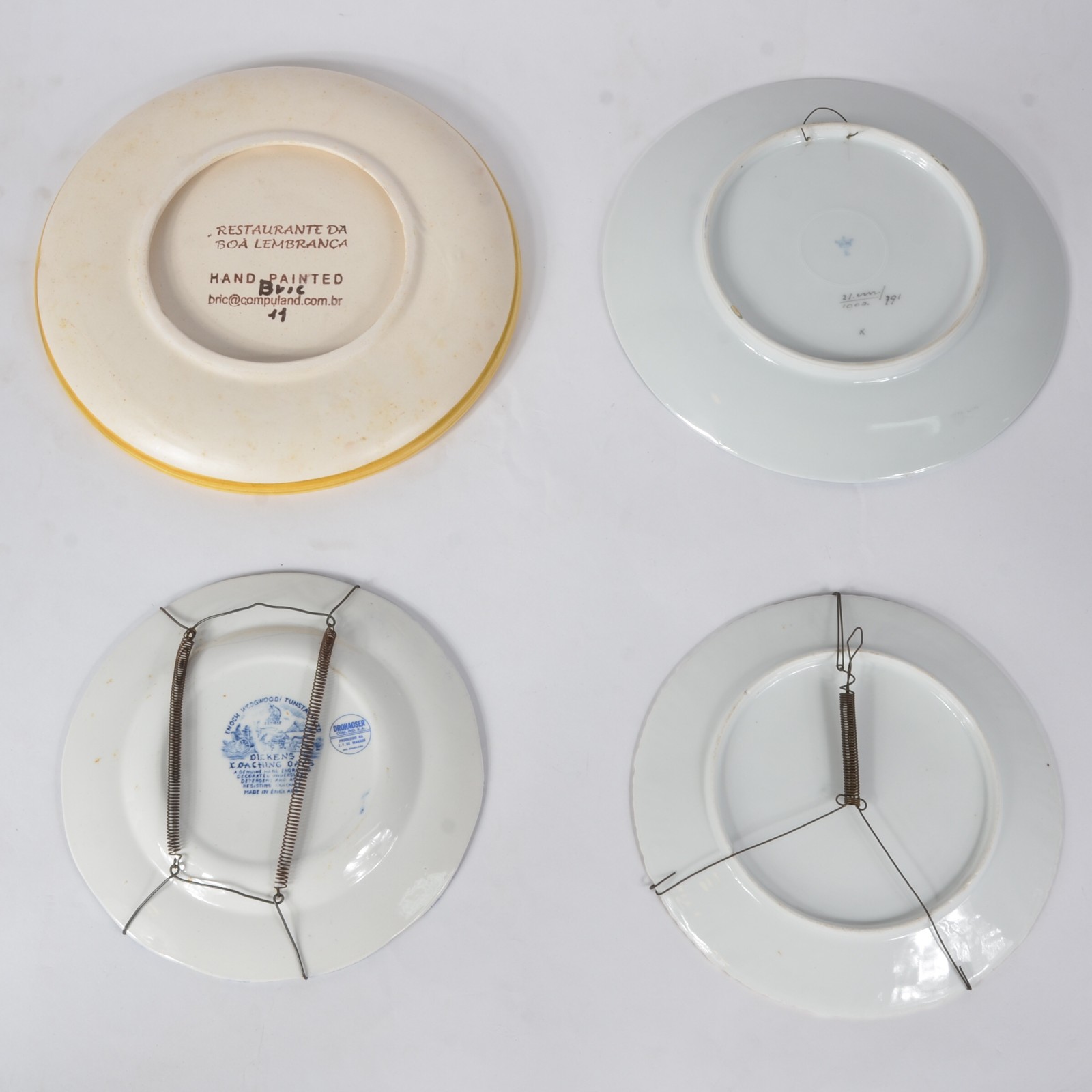 Quatro pratos decorativos de parede de porcelana e cerâmica de... - foto 9 de 9