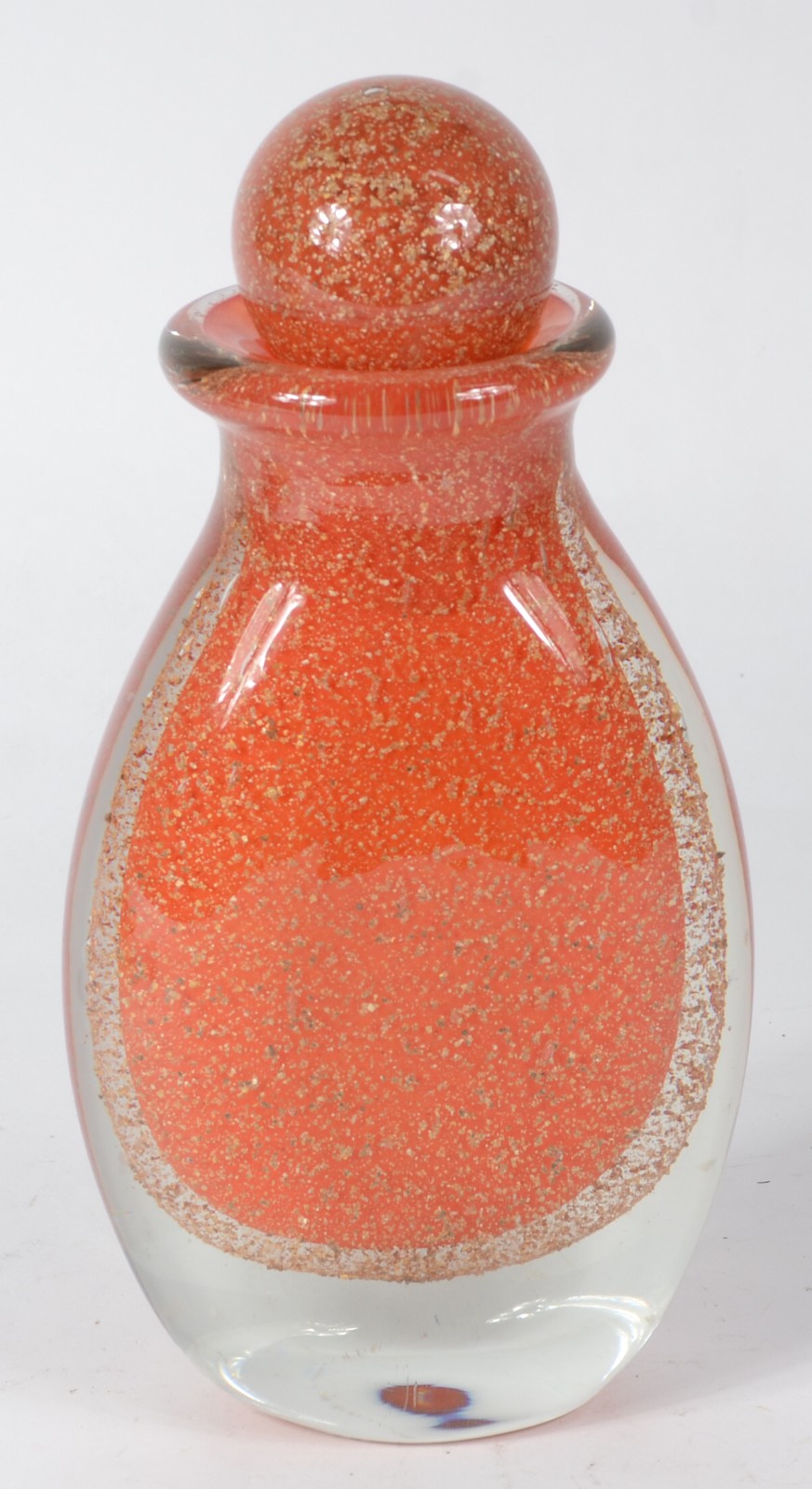 Garrafa com tampa de vidro decorativo na cor laranja com pó de ouro. - foto 1 de 4