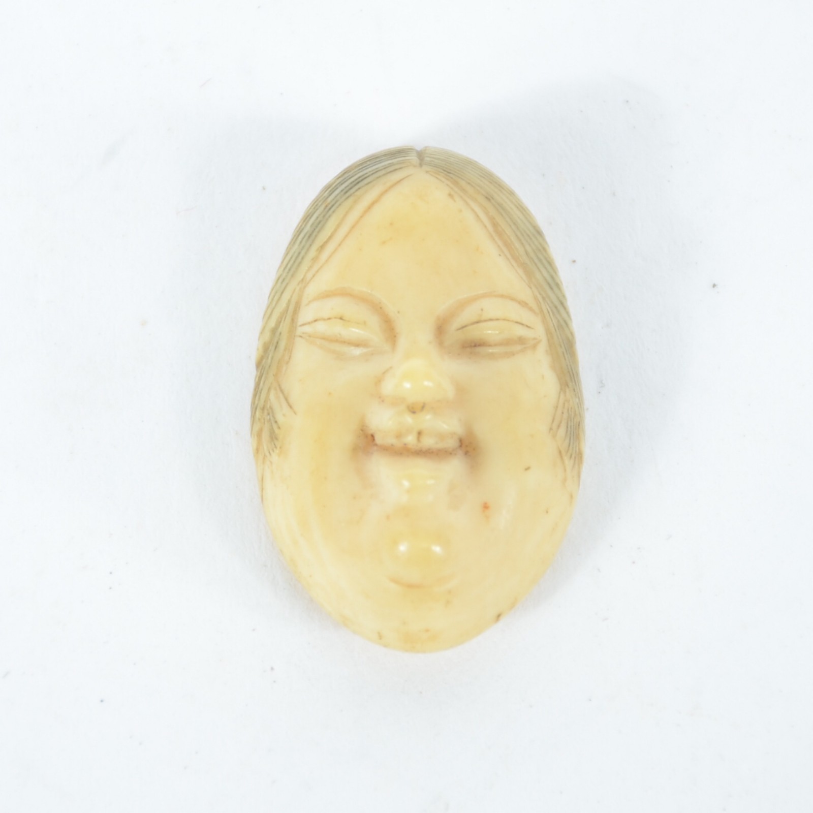 Raro netsuke para criança, esculpido em marfim, representando máscara... - foto 1 de 2