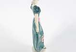 GOLDSCHEIDER,  - Escultura de porcelana americana policromada presentando figura feminina.