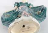GOLDSCHEIDER,  - Escultura de porcelana americana policromada presentando figura feminina.