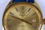 Bucherer - Relógio de metal dourado, pulseira em couro azul, automático. Funcionando.