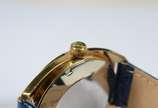 Bucherer - Relógio de metal dourado, pulseira em couro azul, automático. Funcionando.