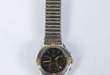 Breitling (1884),  - Relógio de aço com calendário, movimento a quartz, funcionando.