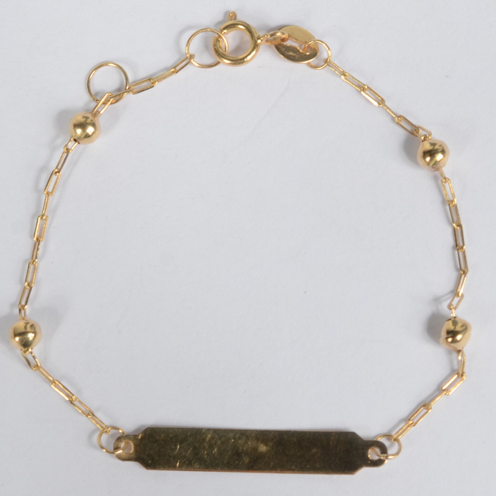 Pulseira de criança, com bolinha de ouro 18k. (Por motivos de... - foto 1 de 4