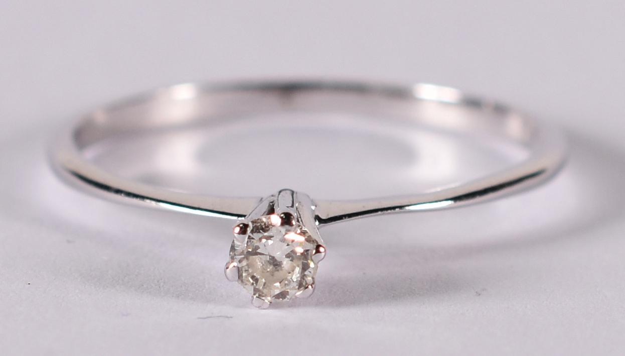 Solitário de ouro branco com brilhante de aproximadamente 0,20 ct... - foto 1 de 3