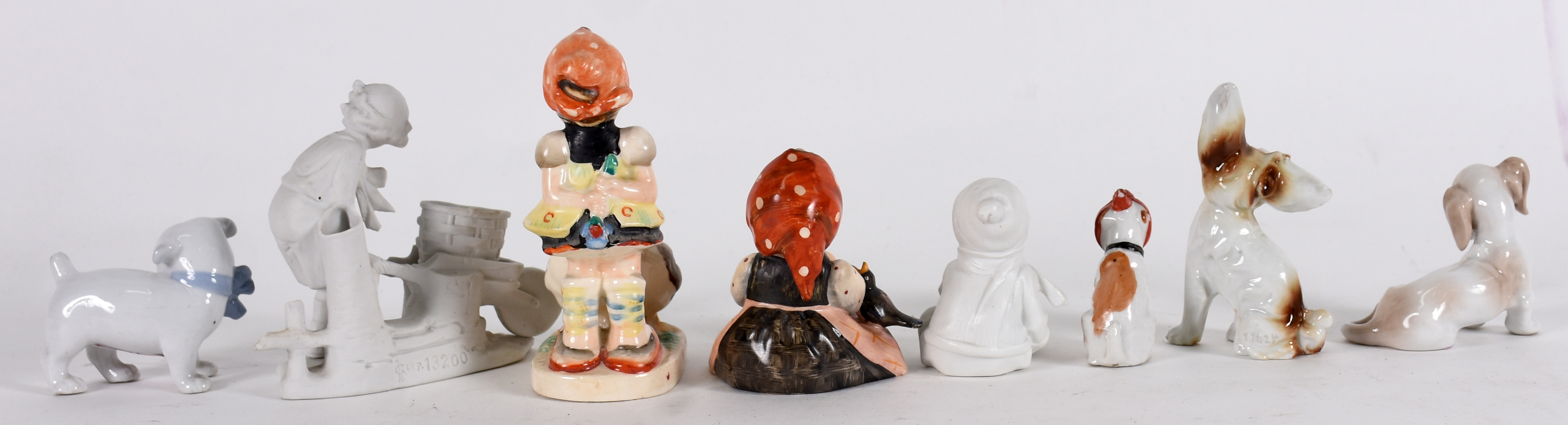 Oito esculturas diversas de porcelana .( medidas de 6 cm à 13 cm ) - foto 2 de 4