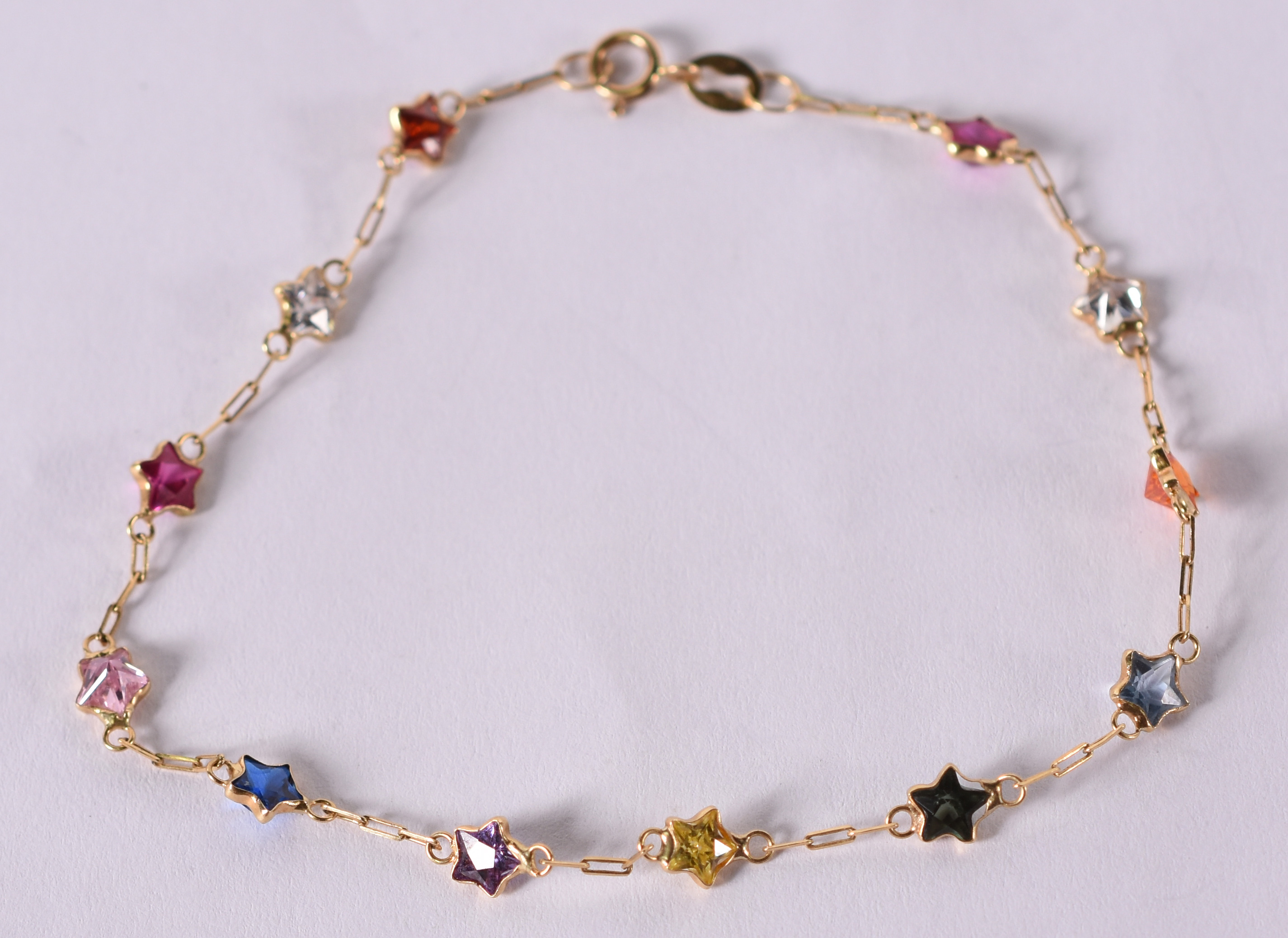 Pulseira de ouro amarelo com pedras coloridas . 1,5 g . ( Por questão... - foto 1 de 3