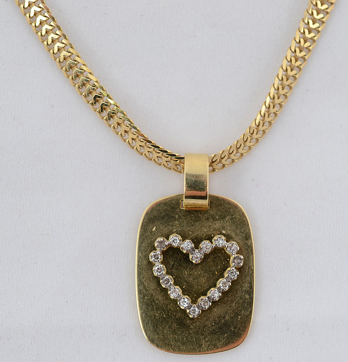 Gargantilha de ouro amarelo 18 k com pendente em forma de coração com... - foto 1 de 2