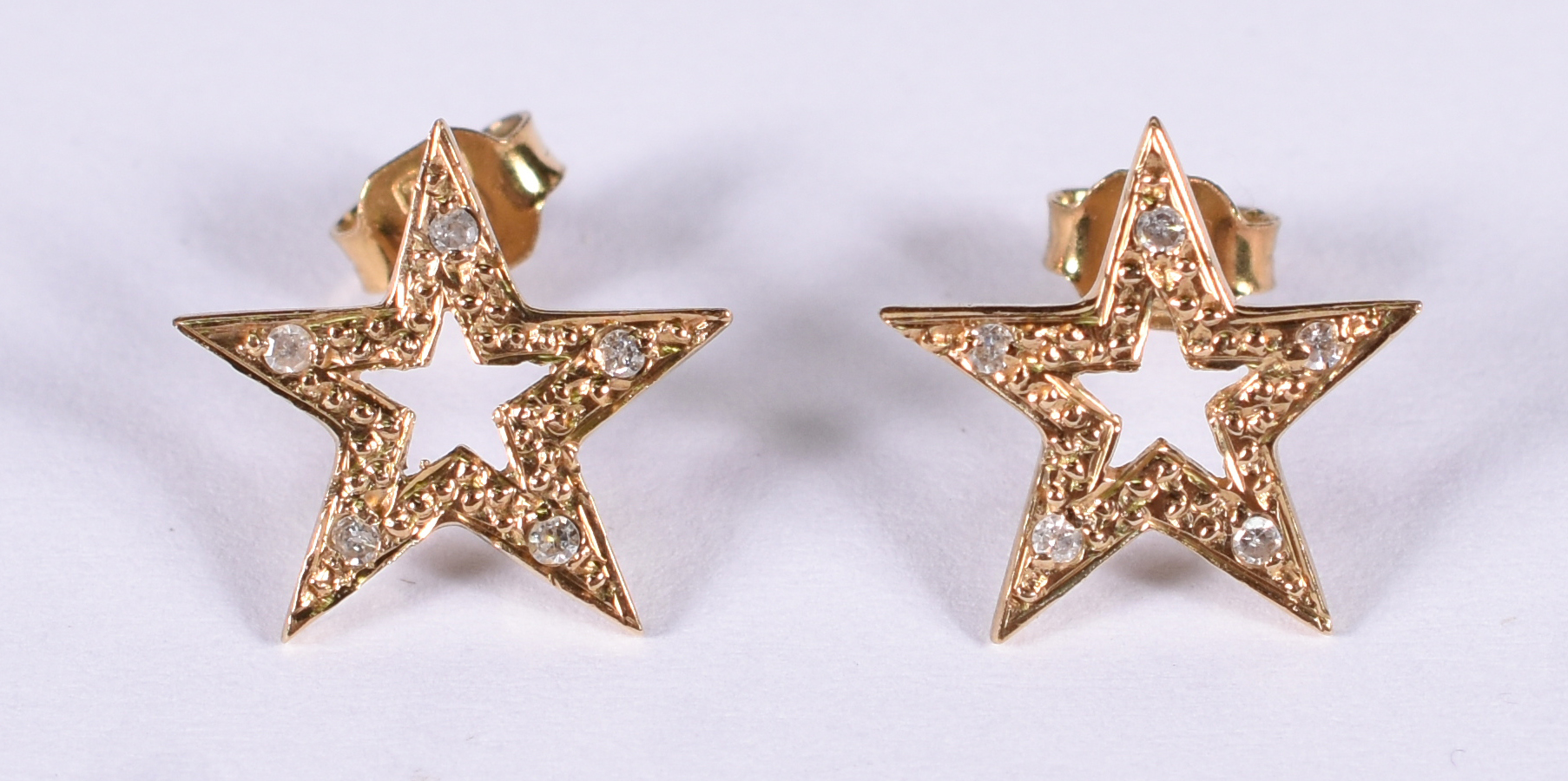 Brinco de de ouro 18 k estrela com brilhantes ( Por questão de... - foto 1 de 3