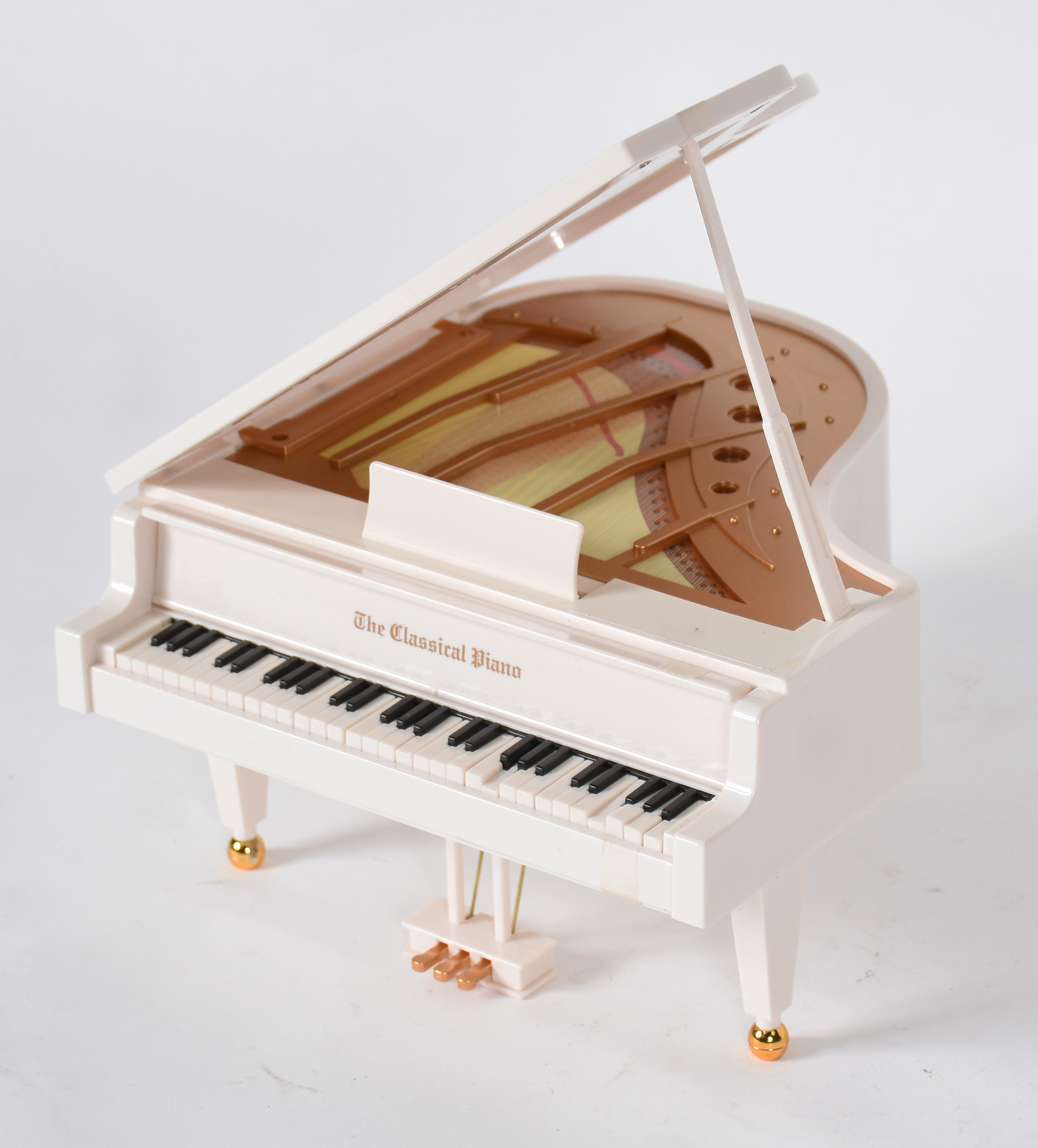Caixa de música de material sintético representando piano com... - foto 2 de 7