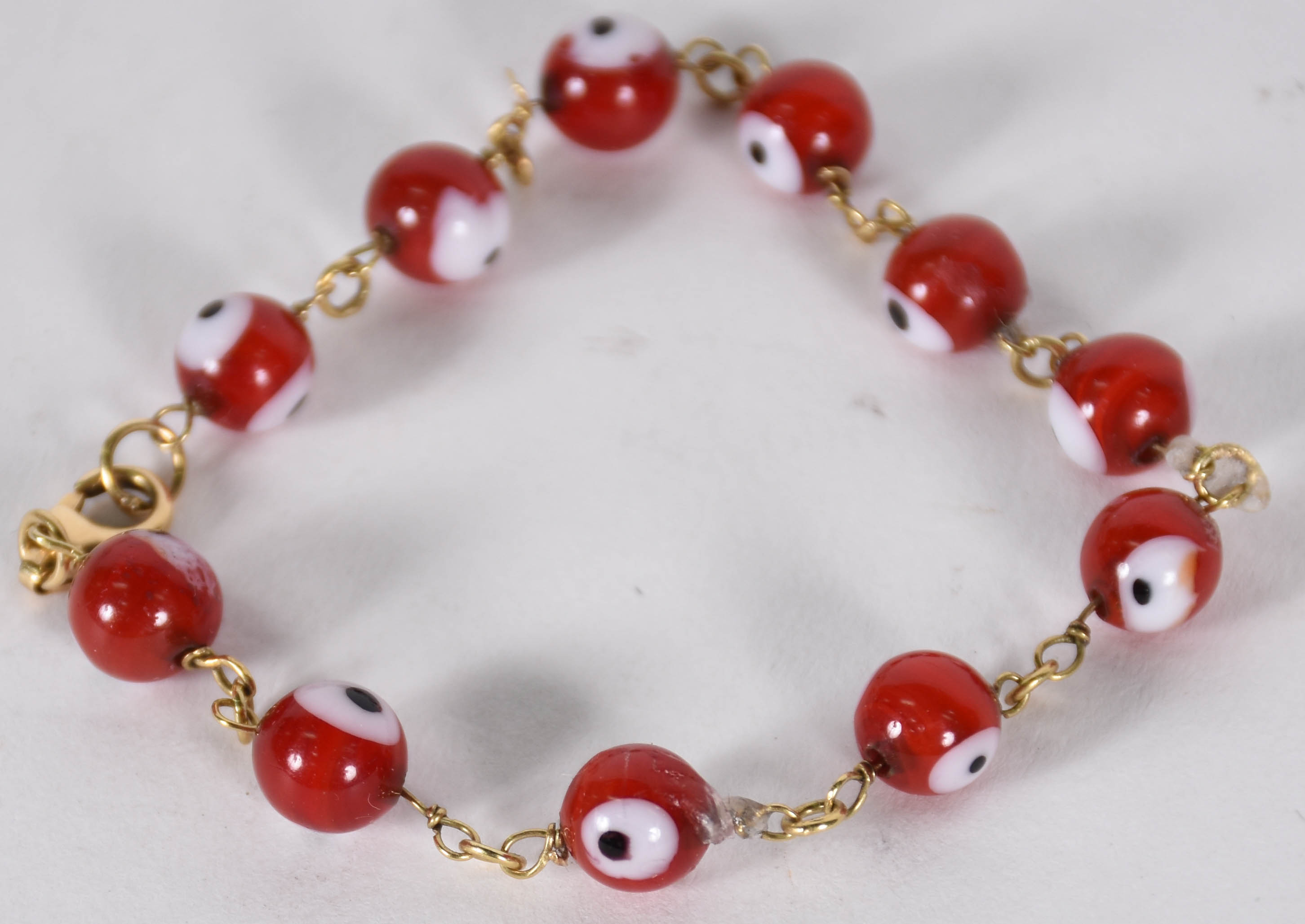 Pulseira com ouro e "olho grande"(por questão de segurança a peça não... - foto 1 de 2