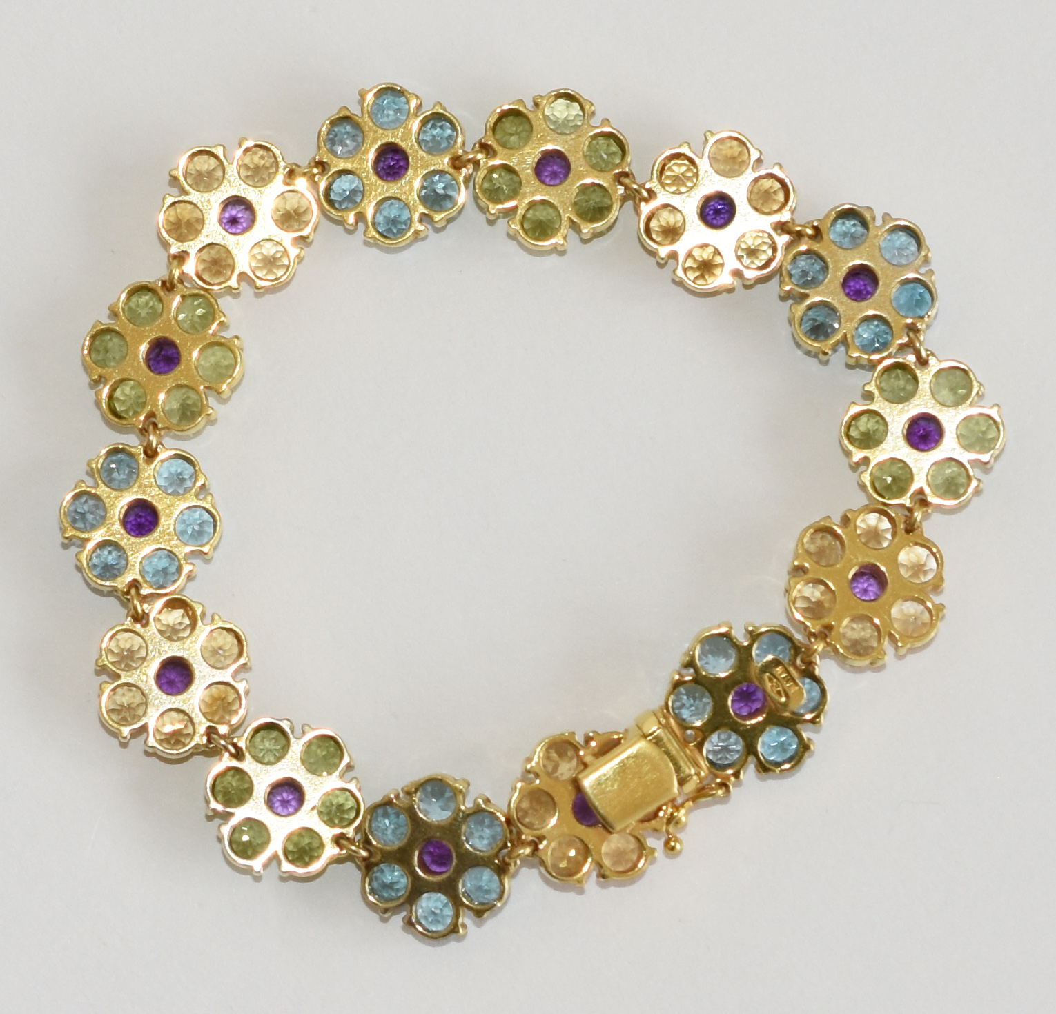 Pulseira Natan de ouro 750 com flores de pedras brasileiras. (Por... - foto 2 de 4