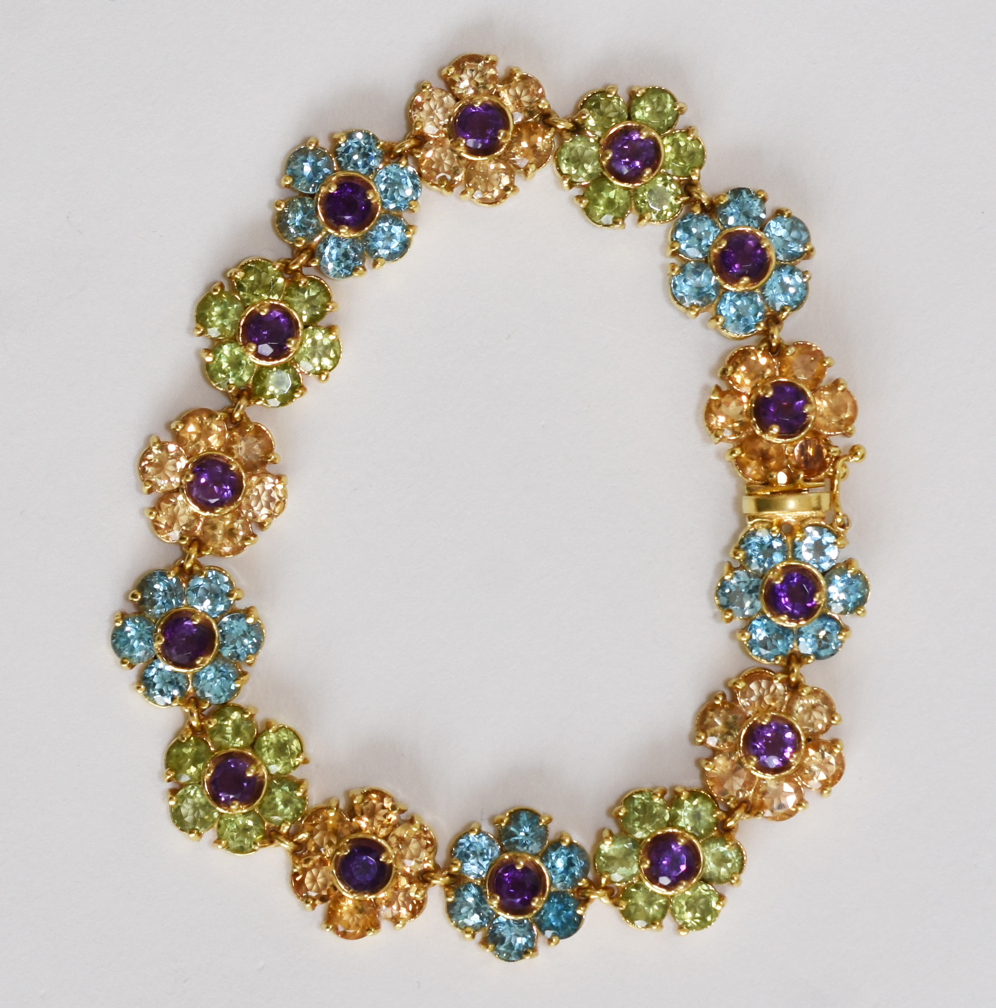 Pulseira Natan de ouro 750 com flores de pedras brasileiras. (Por... - foto 1 de 4